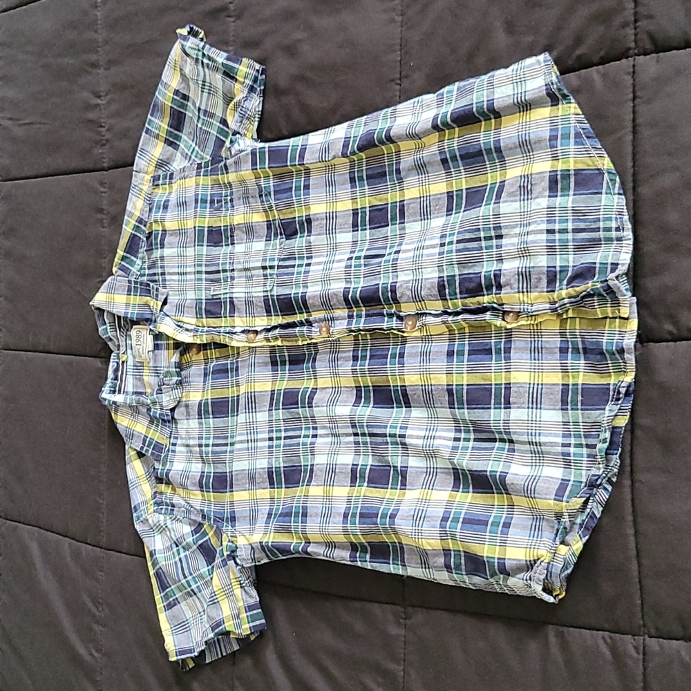 Children place boys shirt